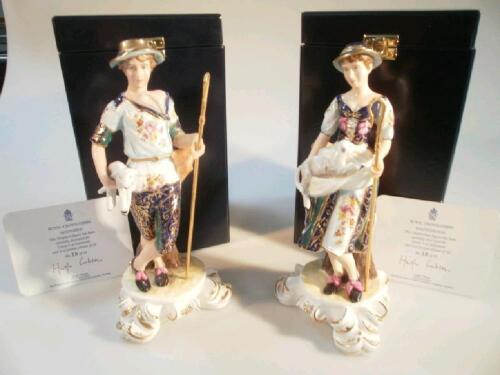 A pair of Royal Crown Derby figures of a shepherd and shepherdess