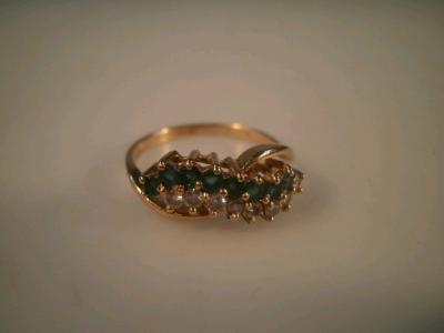 An emerald and diamond 18ct gold ring