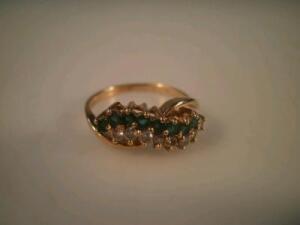 An emerald and diamond 18ct gold ring