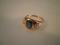 An 18ct shanked sapphire and two mine cut diamonds signet ring with three stones