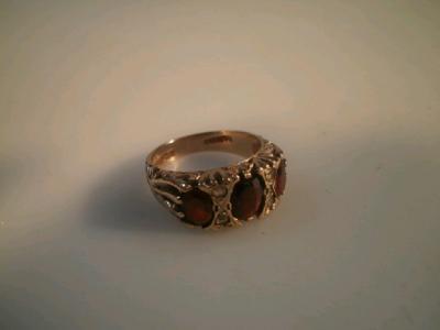 A garnet and diamond 9ct gold ring