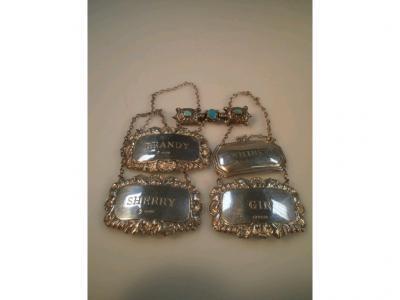 Four silver decanter labels