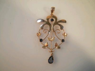 An Edwardian style pierced and stone set pendant marked 9c