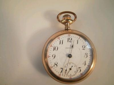 A gold plated open face pocket watch by Waltham