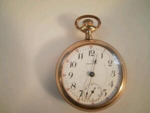 A gold plated open face pocket watch by Waltham