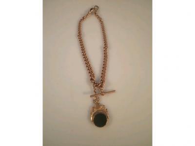 A 9ct rose gold Albert with attached double agate faced fob
