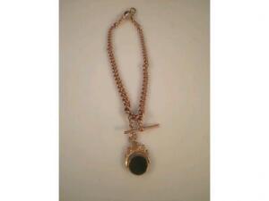 A 9ct rose gold Albert with attached double agate faced fob