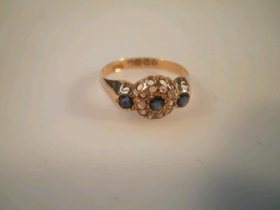 A sapphire and diamond cluster ring