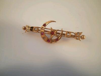 A late Victorian 9ct gold bar brooch with crescent and star centre