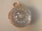 An Edwardian 9ct gold mounted rock crystal ball pendant