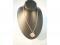 A 9ct gold circular locket with engraved decoration and chain