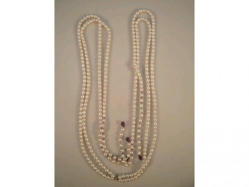 A freshwater pearl soutoire with amethyst bead terminals