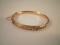 A 15ct Victorian seed pearl set hinged bangle