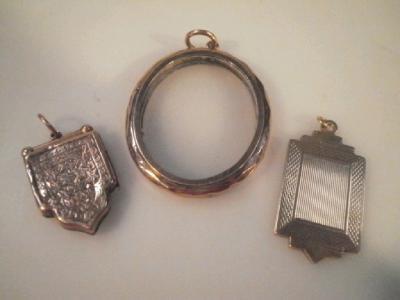 A glass faced locket, frame stamped 9ct, and two 9ct gold fobs