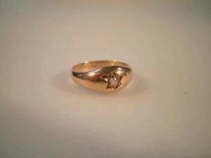 A man's bombe shaped signet ring set with a single diamond of 0.05ct approx