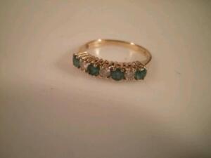 An emerald and diamond set ? hoop eternity ring