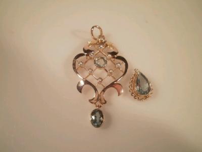 An Edwardian style seed pearl and aquamarine set openwork pendant