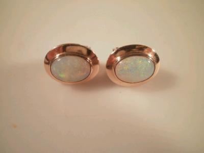 A pair of opal set earrings stamped 14ct clip backs