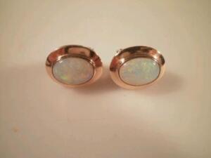 A pair of opal set earrings stamped 14ct clip backs