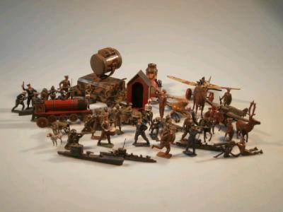 A small collection of vintage model tin plate toys