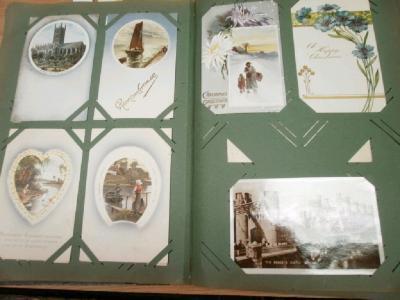 An early 20thC postcard album contain a large quantity of GB and foreign topographical