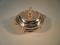 A silver plated circular tureen with strainer with rococo style handles