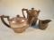 An early 20thC silver boat shape teapot with half lobed body and fruit