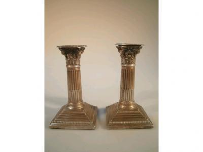 A pair of late Victorian silver composite column boudoir candlesticks by