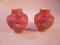 A pair of late 19thC cased glass baluster vases