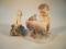A Royal Copenhagen figure of a faun and frog