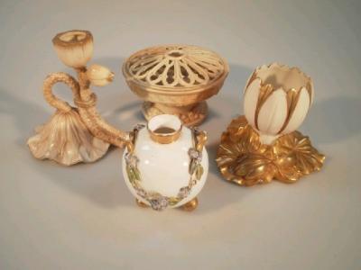 A Royal Worcester chamber stick modelled as a flower and bud and three