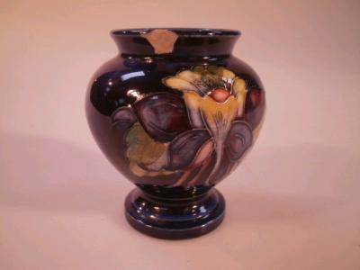 A Moorcroft pottery Columbine pattern baluster vase