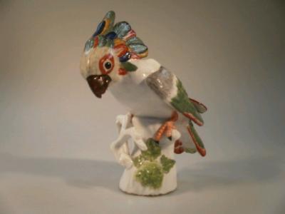 A 19thC German porcelain figure of a Cockatoo decorated in polychrome enamels