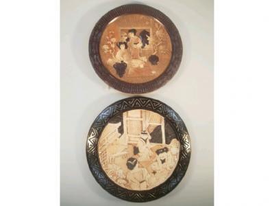 A matched pair of Bretby pottery aesthetic period wall plaques
