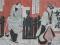 A 19thC Japanese wood block print depicting a gentleman and a lady