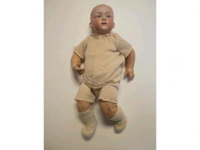 A bisque headed late 19thC baby doll