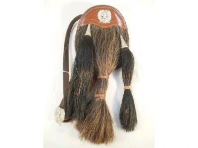A leather sporran with applied badge London Scottish regimental badge and