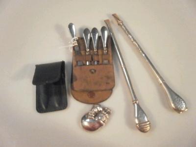 A silver handled manicure set