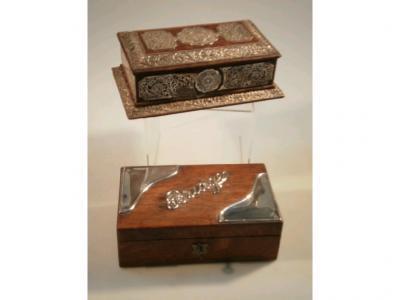 A Tiffany & Co hardwood trinket box decorated with filigree white metal