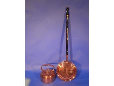 A Victorian copper warming pan with turned handle and a copper kettle