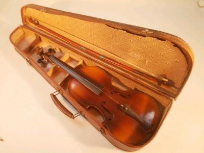 A violin, with a two-part back measuring 34cm below the button
