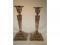 A pair of Edwardian silver plated neo-classical candlesticks cast in relief with goat mask