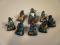 A set of eight miniature white metal Chinese immortals decorated with polychrome enamels