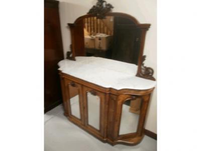 A mid Victorian walnut chiffonier with rectangular mirrored back