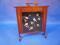 An aesthetic movement mahogany fire screen