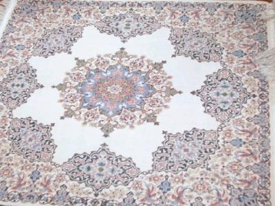 A beige ground floral design Persian rug