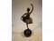 A cast metal figure of a ballerina on circular marble plinth
