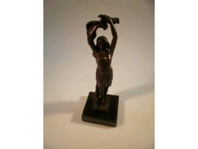 A cast metal figure of an exotic dancer on square plinth