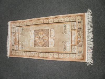 A small silk Chinese rug