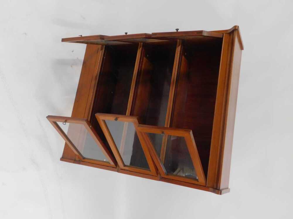 An Edwardian mahogany and inlaid three sectional bookcase, each section ...